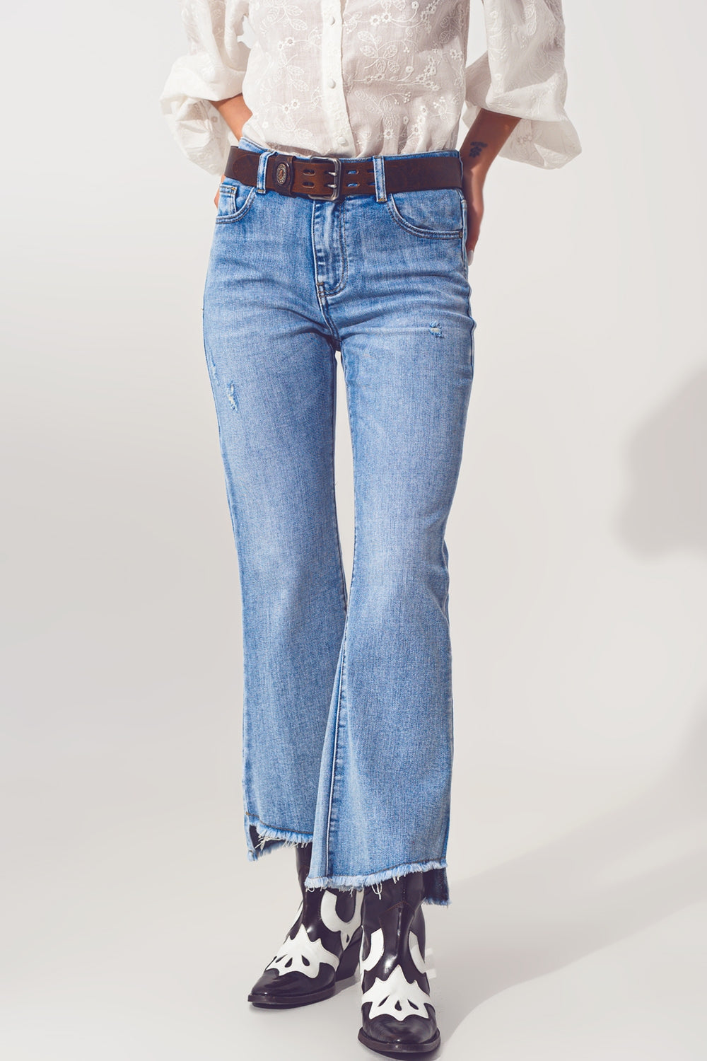 Flared Jeans in Light Blue with Asymmetric Hem - Denim