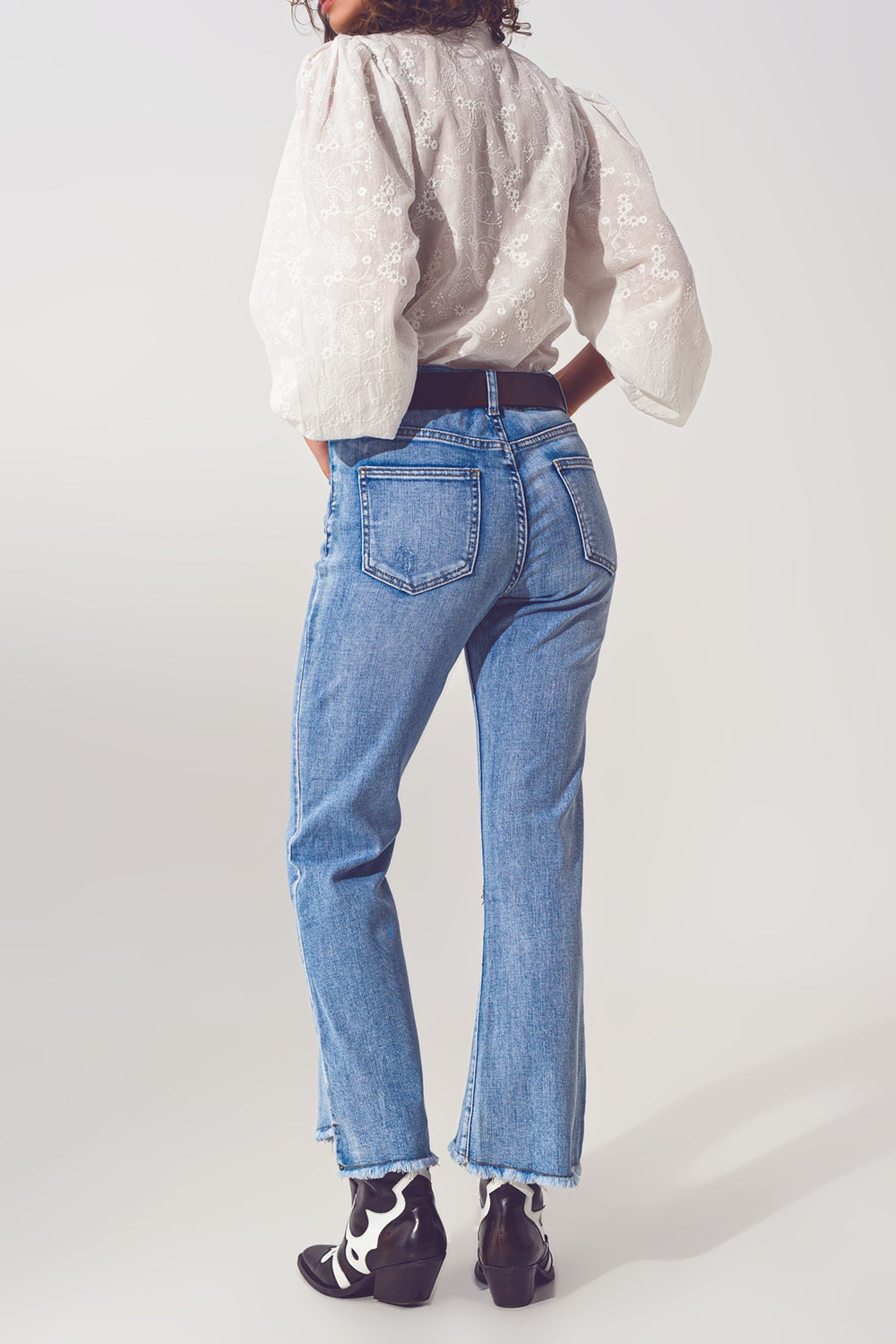 Flared Jeans in Light Blue with Asymmetric Hem - Denim