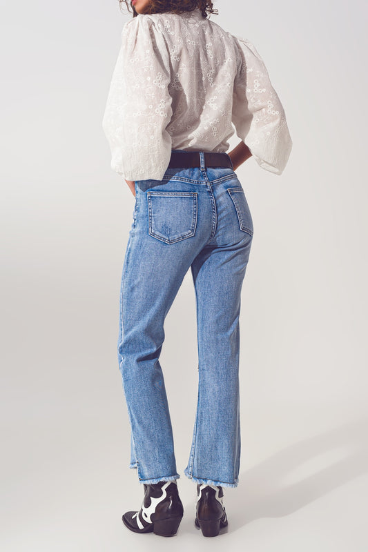 Flared Jeans in Light Blue with Asymmetric Hem - Denim