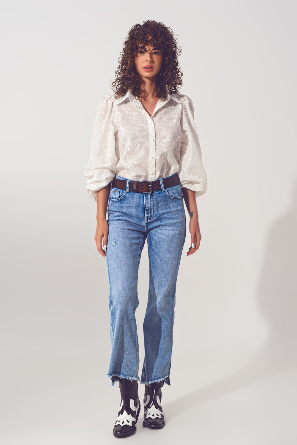 Flared Jeans in Light Blue with Asymmetric Hem - Denim