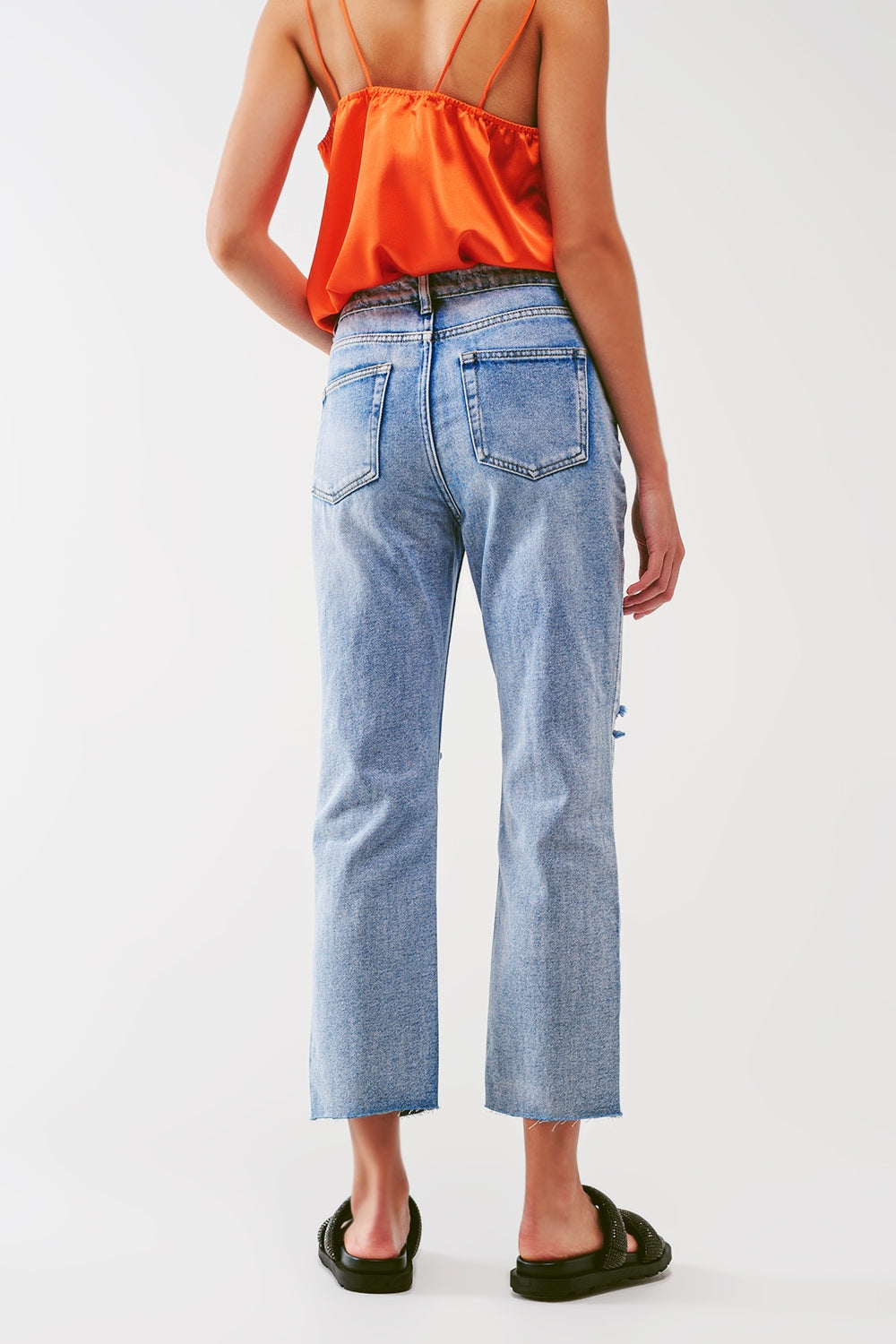 Sraight-leg jeans with exposed buttons and ripped knees in light wash - Denim