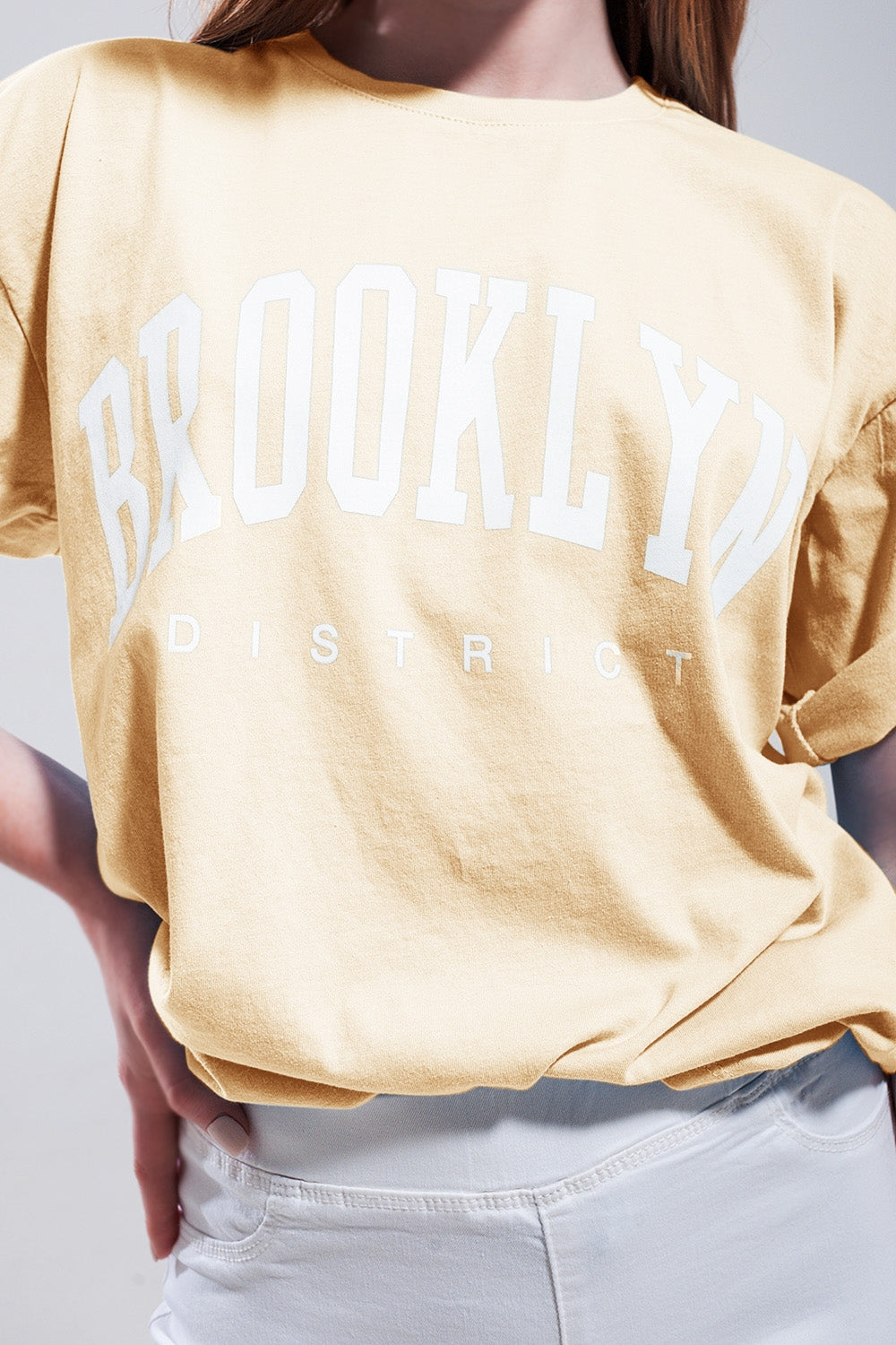 T-Shirt with Brooklyn District Text in yellow - top