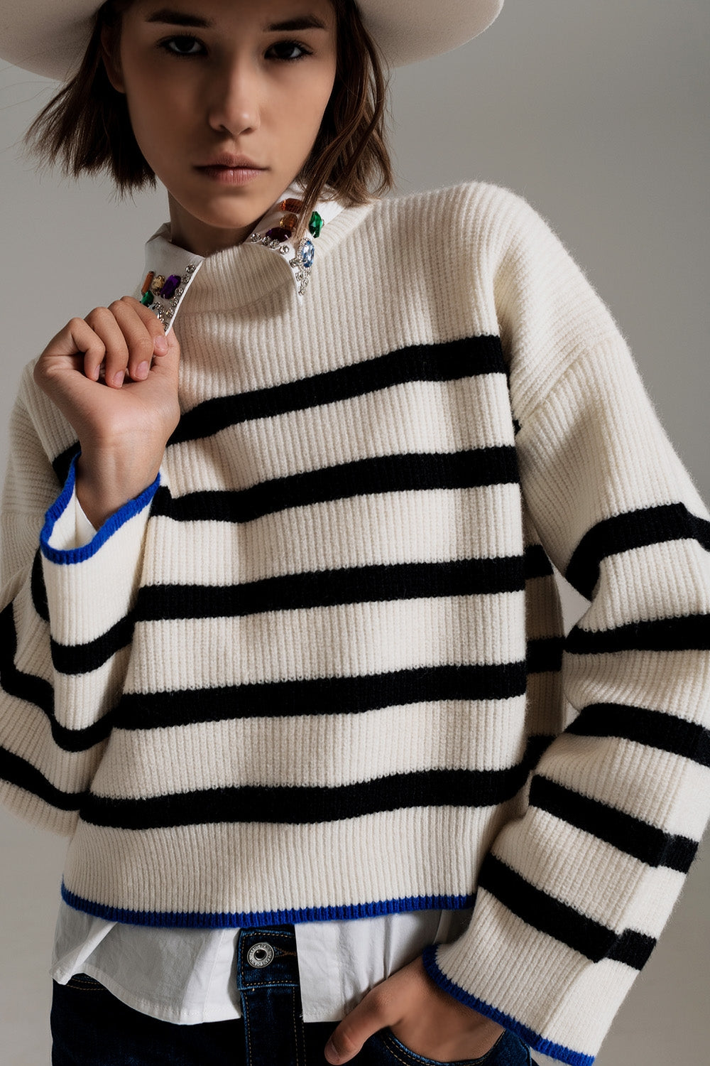 black striped jumper with blue stripe detail on the bottom