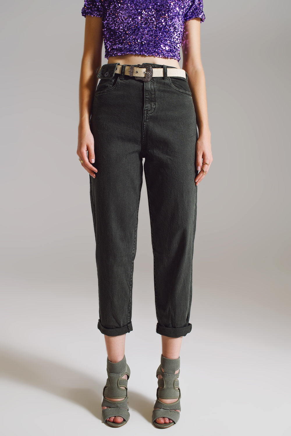 Khaki green relaxed pants with pocket detail at the waist
