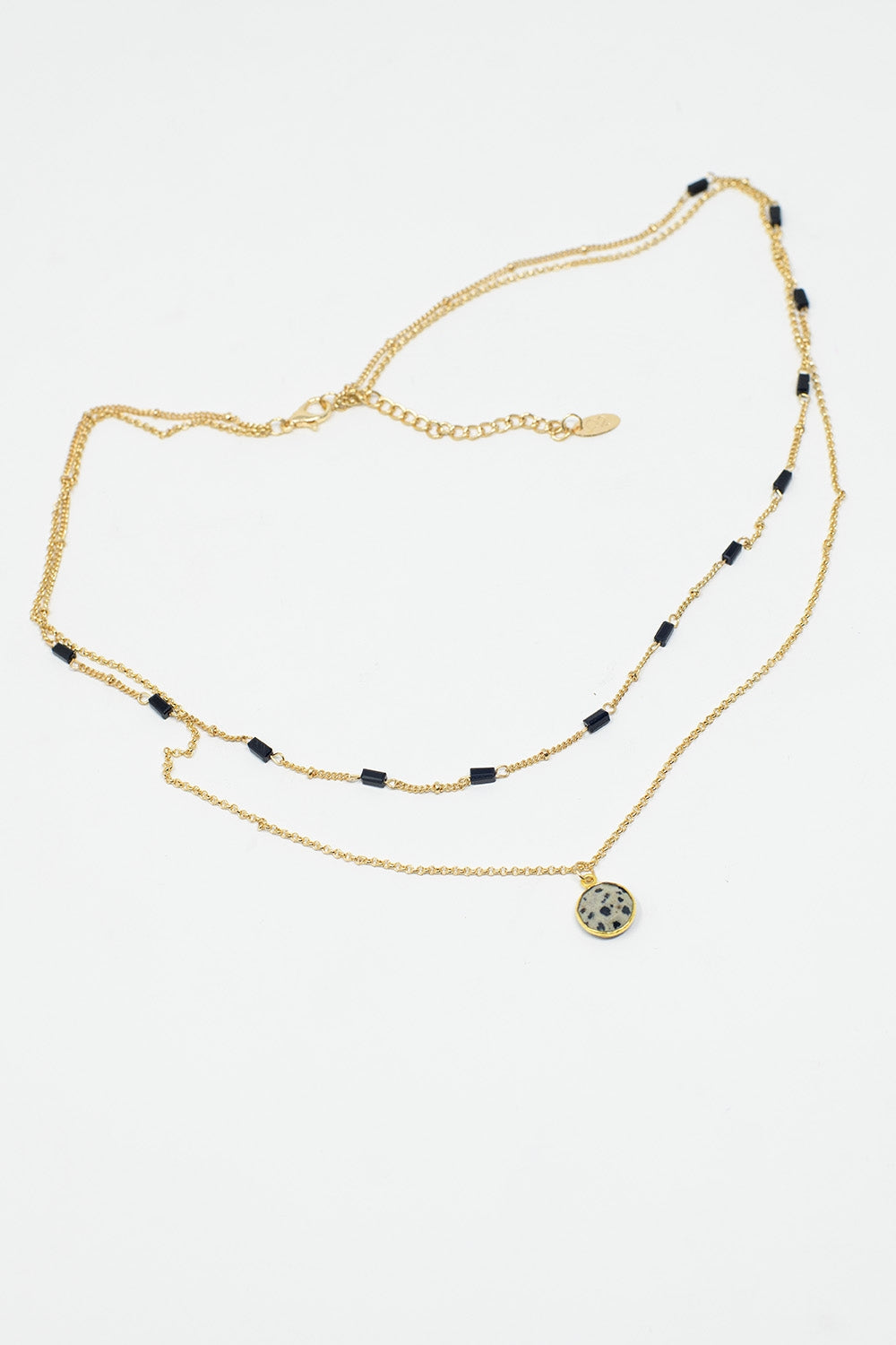 Short 2 in 1 Gold Necklace with Black Beads and White Marbled Stone.
