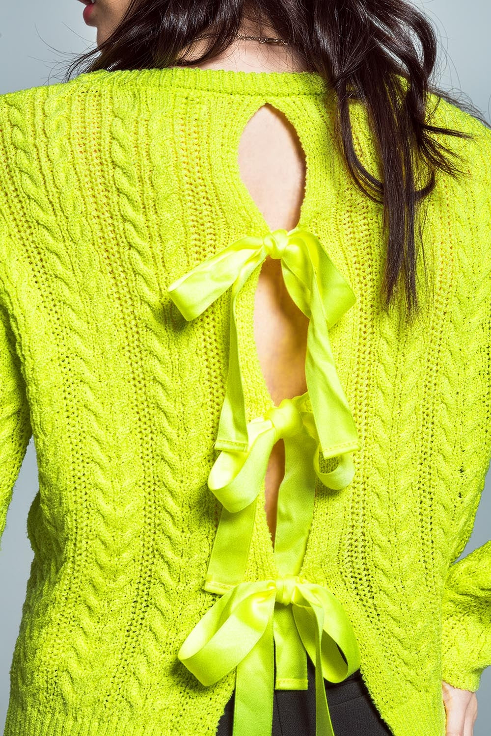 Lime green cable knit jumper with open back and bows