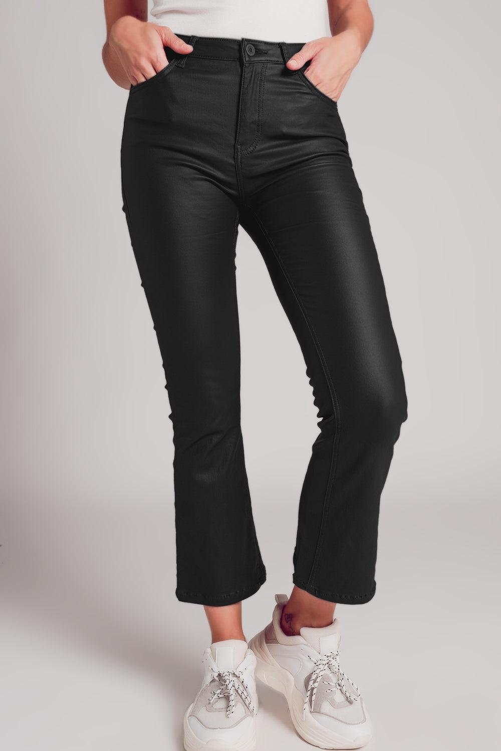 Stretch faux leather flare pants in black - trousers