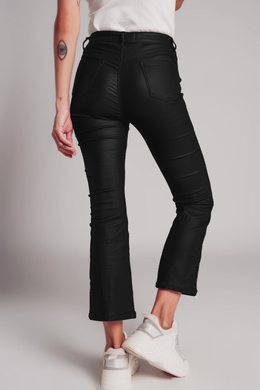 Stretch faux leather flare pants in black - trousers