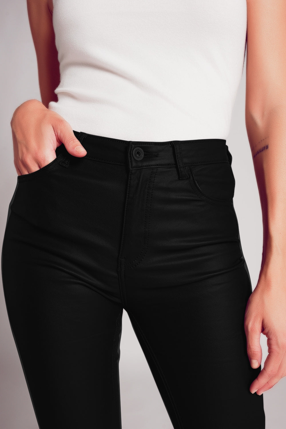 Stretch faux leather flare pants in black - trousers