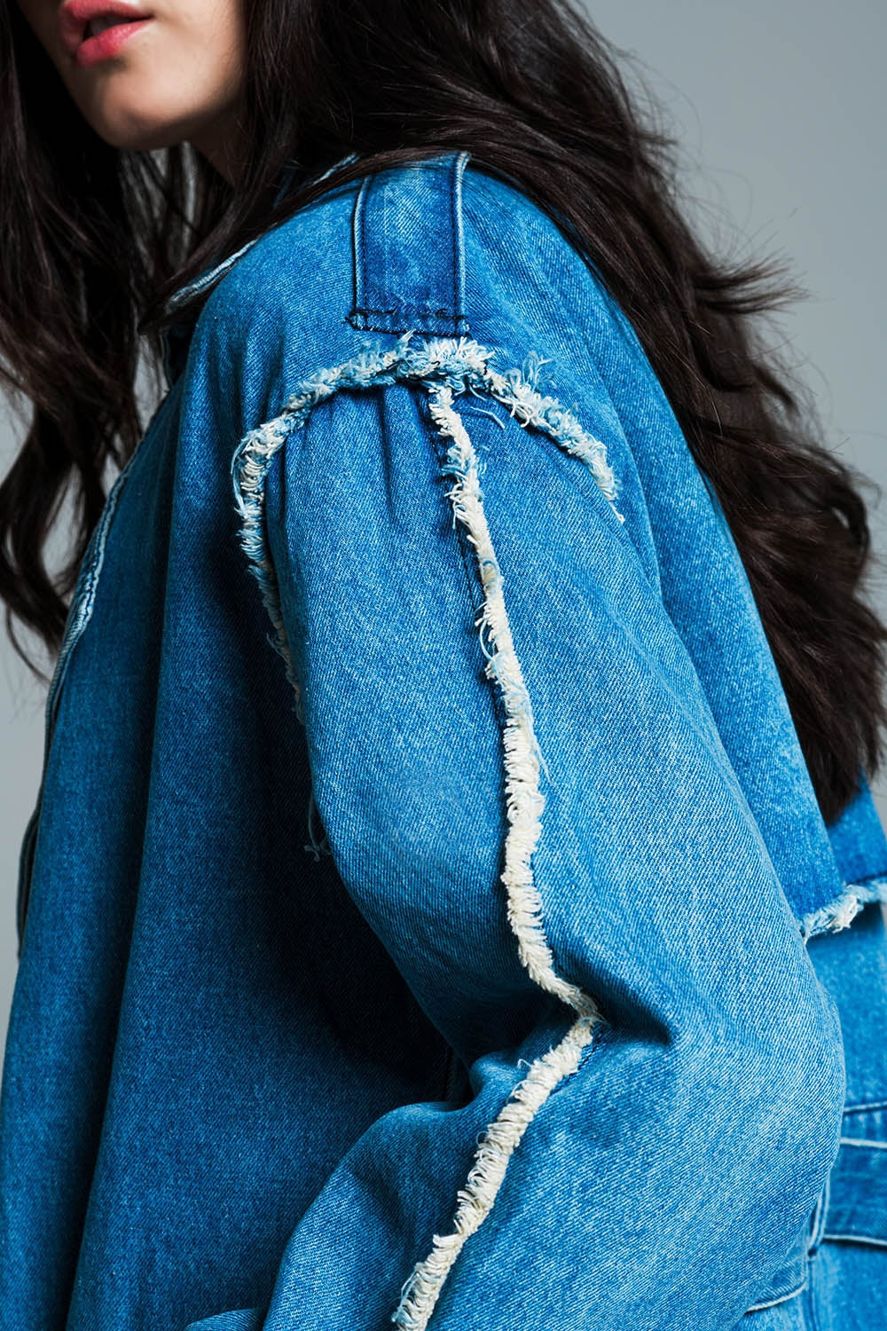 Demin trench coat with belt and raw edges in mid wash