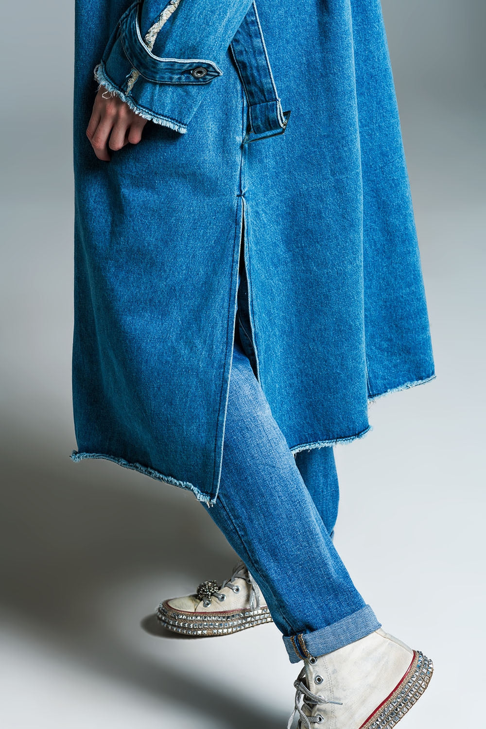 Demin trench coat with belt and raw edges in mid wash