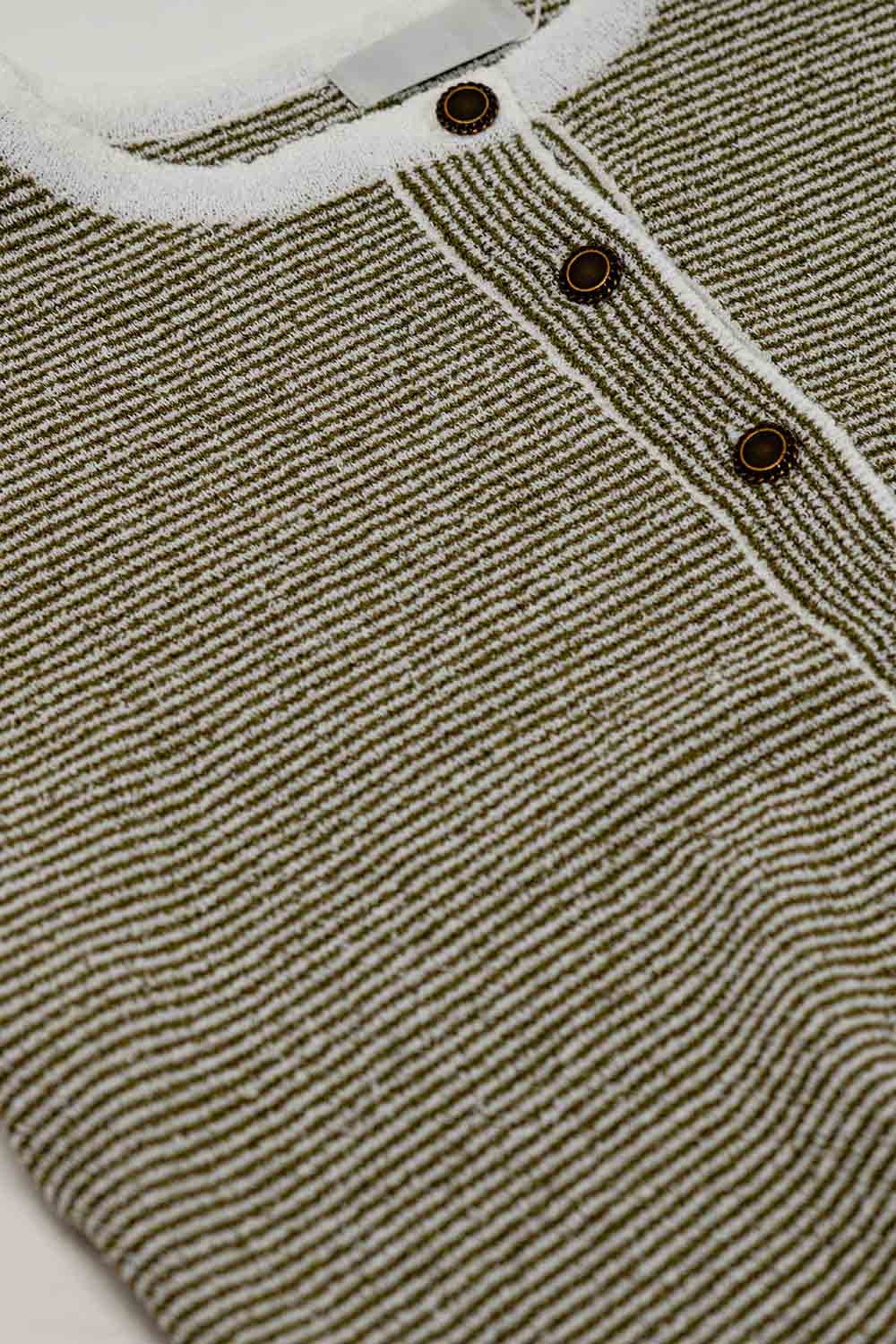 sweater with khaki stripes and gold button closure
