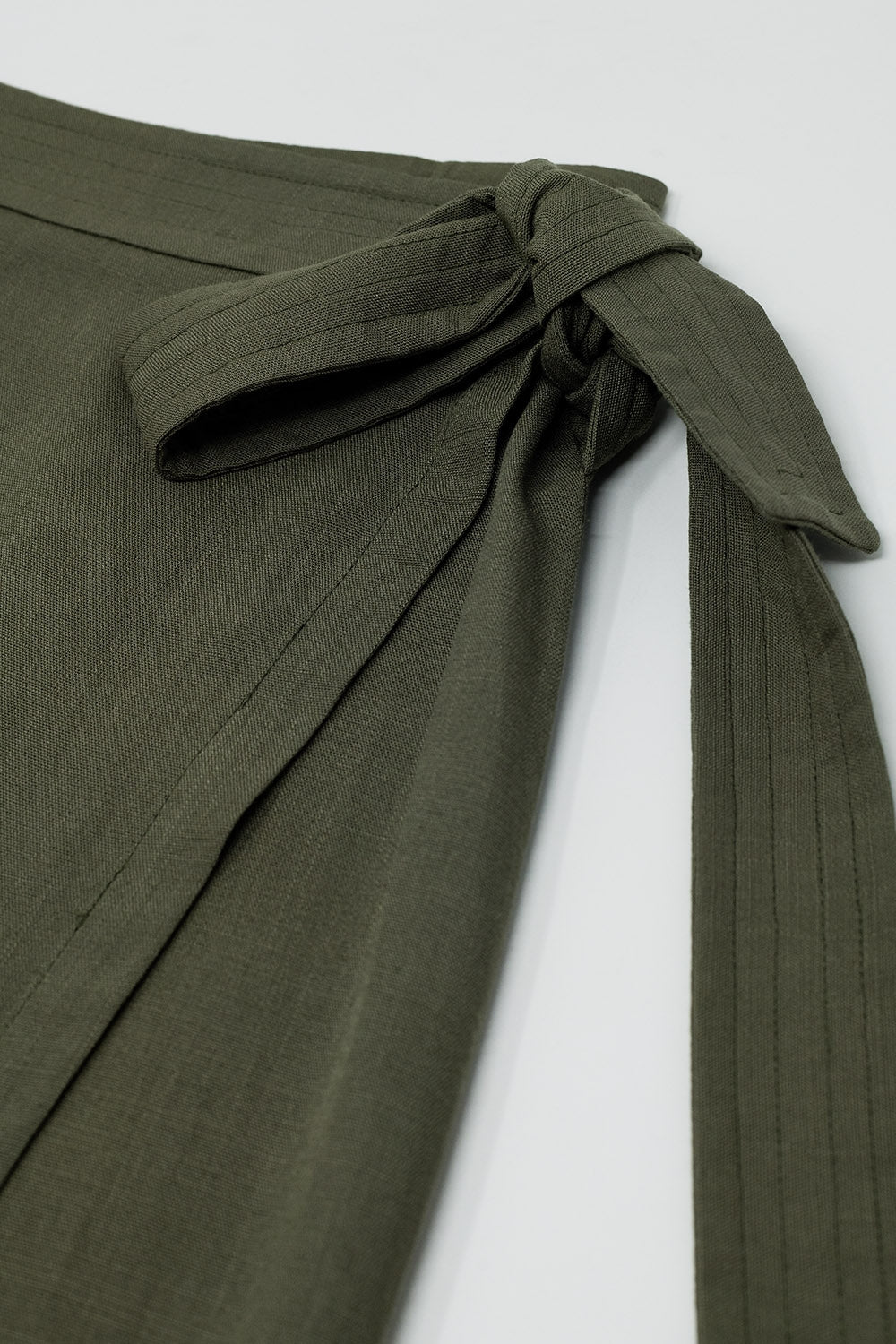 Khaki mid-length skirt with one pocket and a lace detail