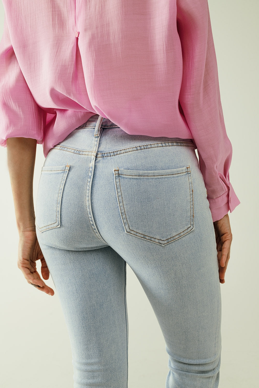 Flared light blue jeans with five pockets and seamless finish - Denim