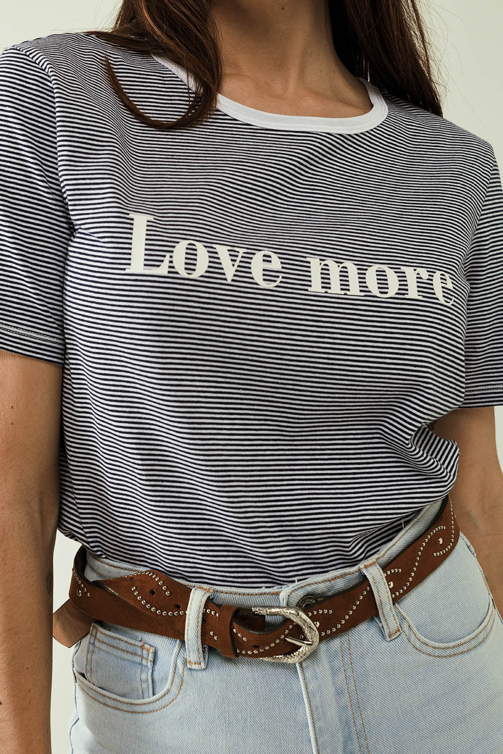 White T-shirt with black stripes and Love More texted - top