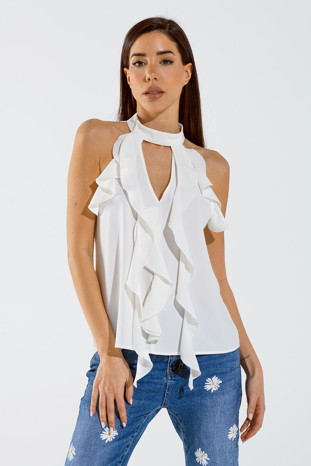 Sleeveless White Top with Ruffled Details and High Neck