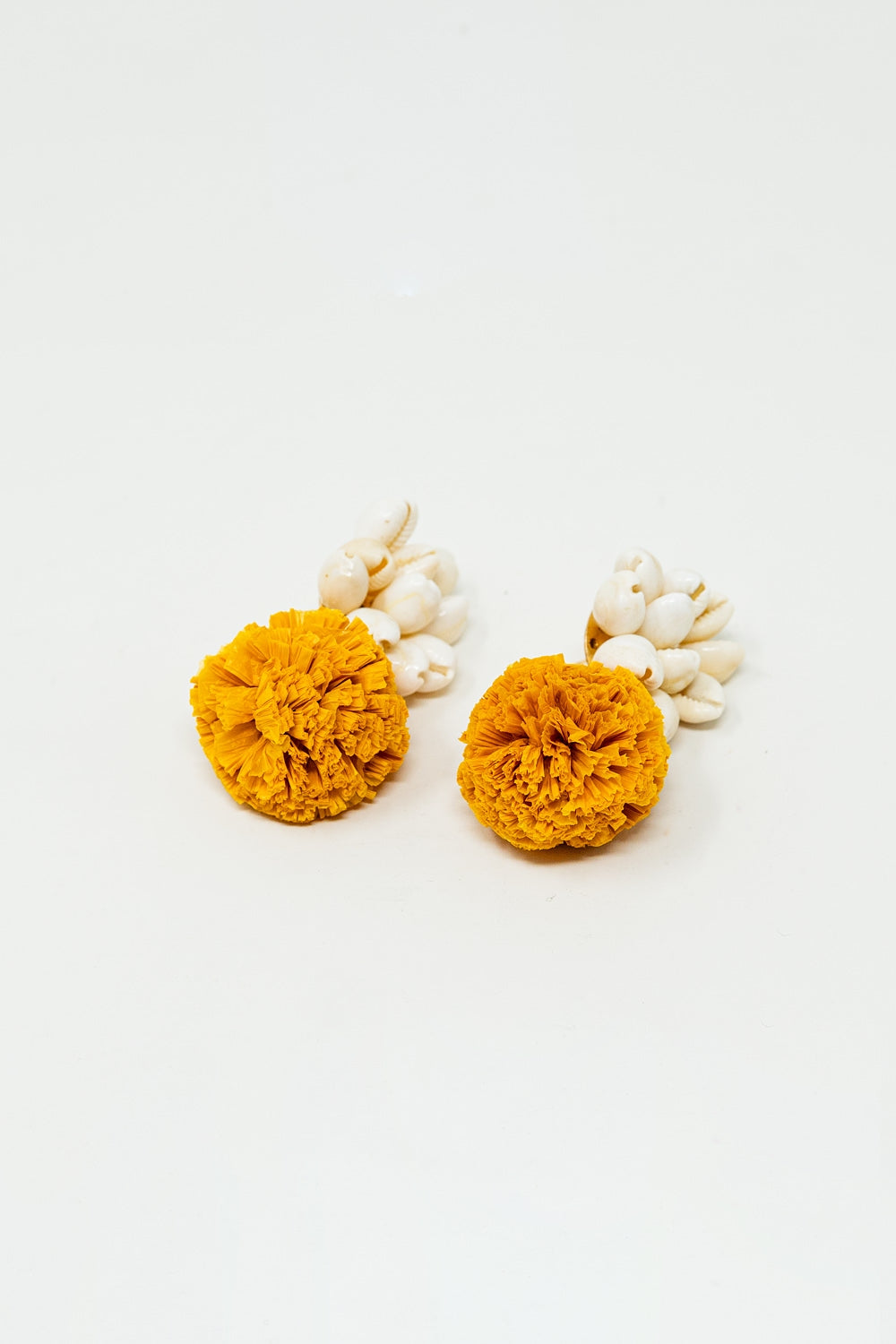 Earrings With Cream Seashells and Yellow Pom Poms