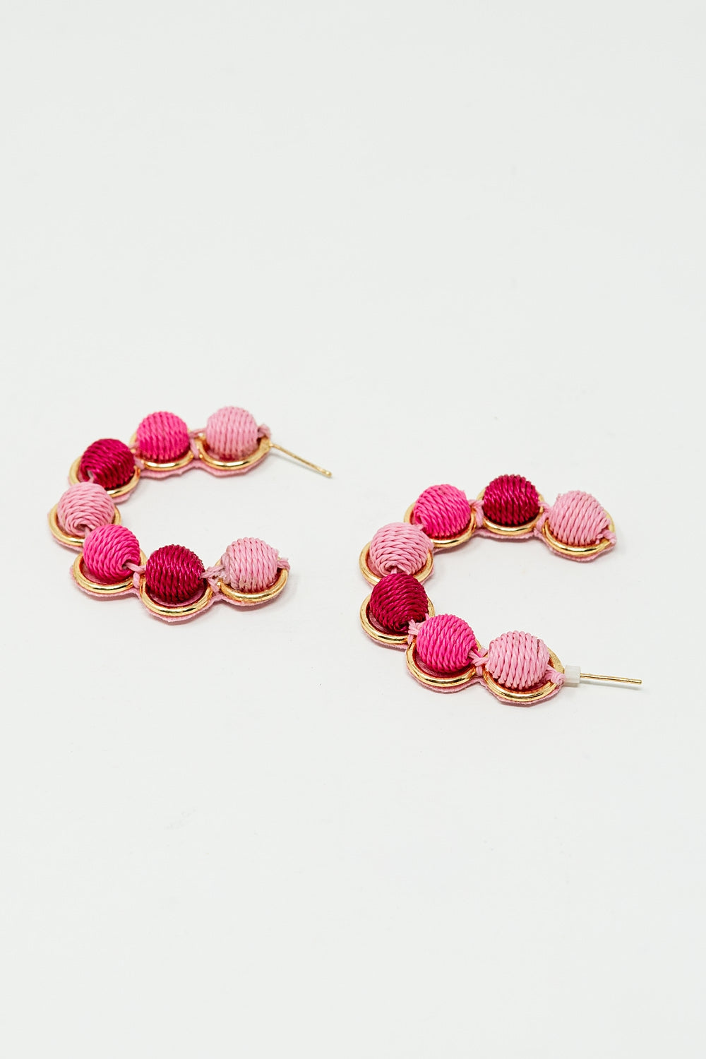 Gold Hoop Earring With Woolen Spheres in Pink and Fuchsia