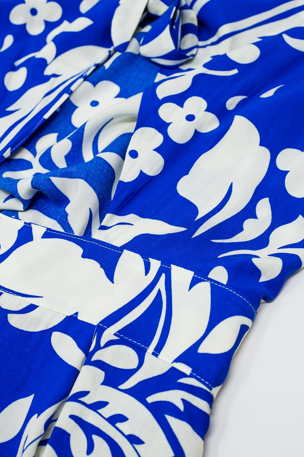 Short Sleeve Key Hole Front Floral Jumpsuit In Blue