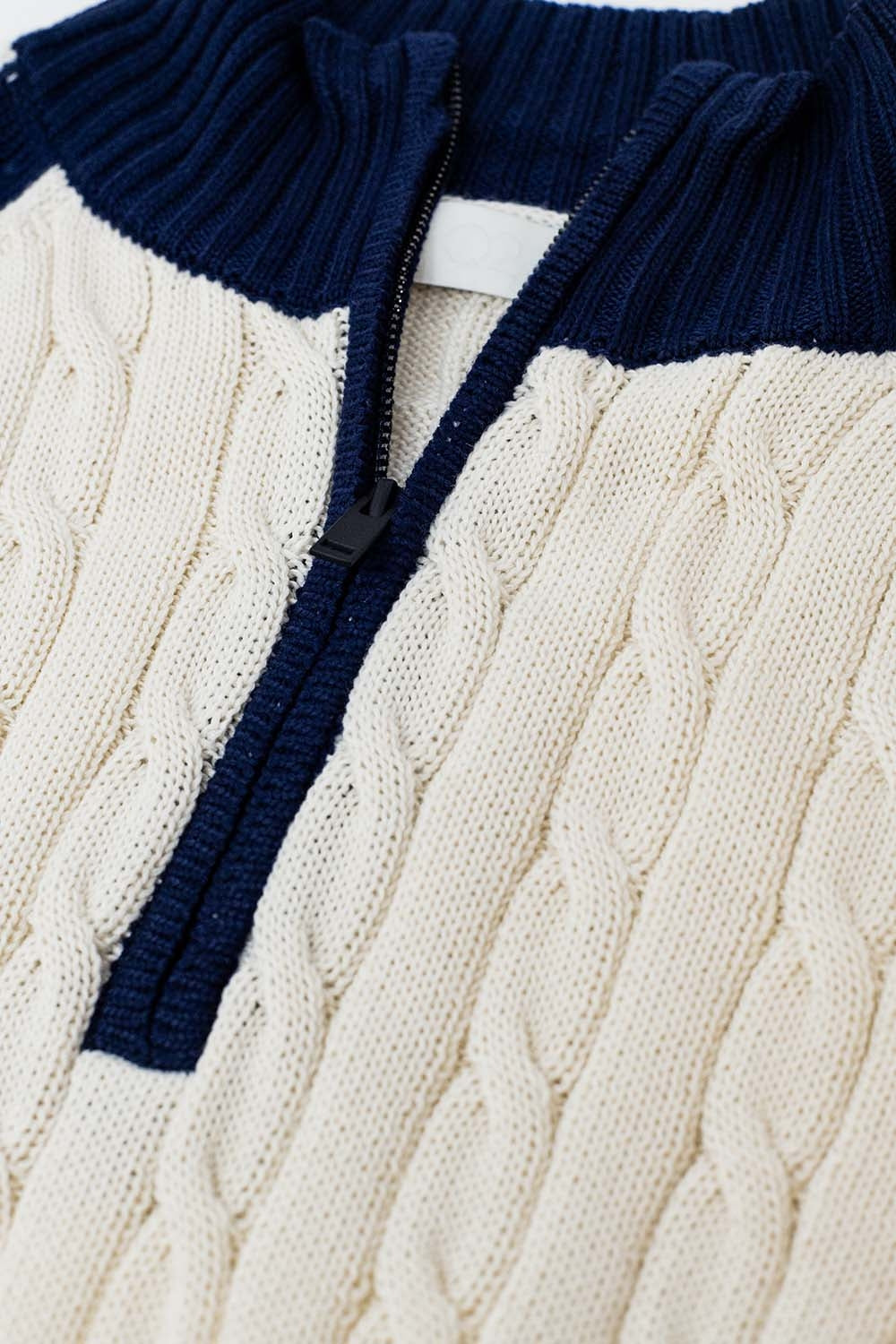 cropped white and navy sweater with neck zipper