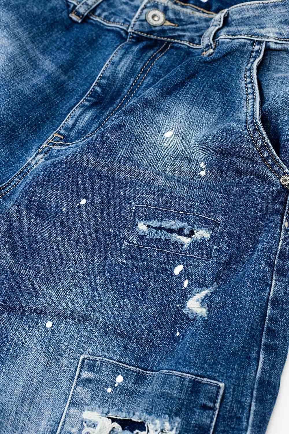 Loose-fitting jeans with distressed patches and paint details - Denim