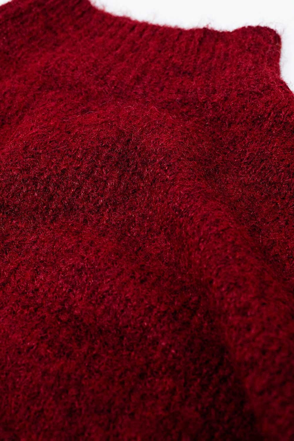 Fluffy red sweater with high neck and balloon sleeves