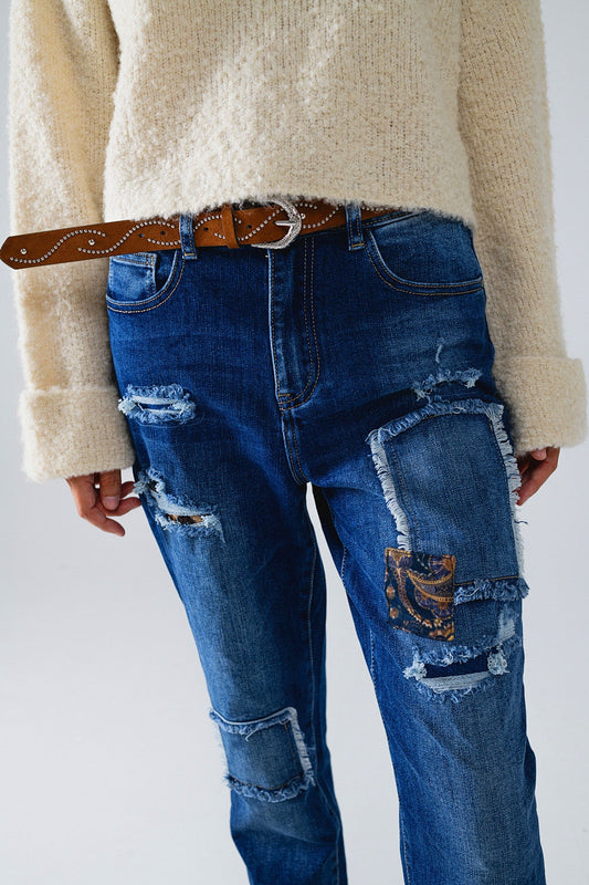Loose blue jeans with subtle ripped design and patches - Denim