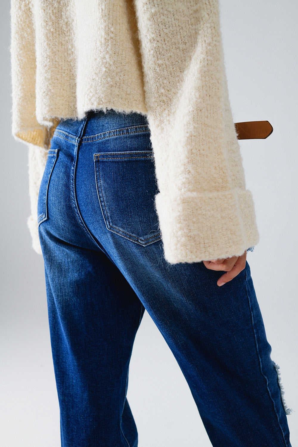 Loose blue jeans with subtle ripped design and patches - Denim