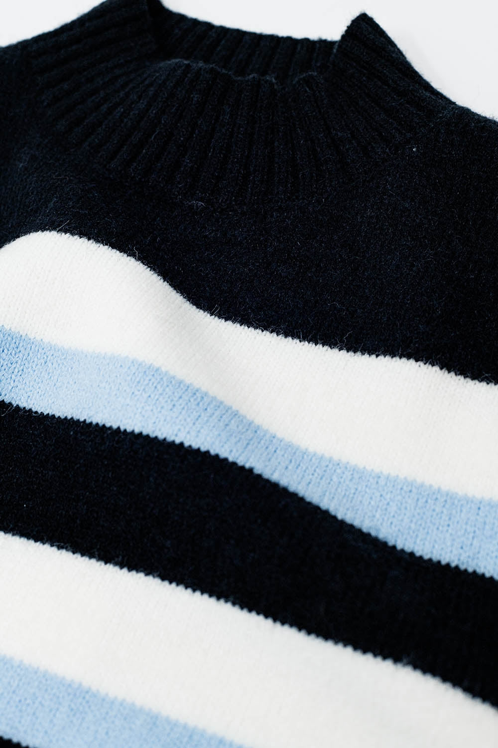 Black sweater with blue and white stripes and a high neck - jumper