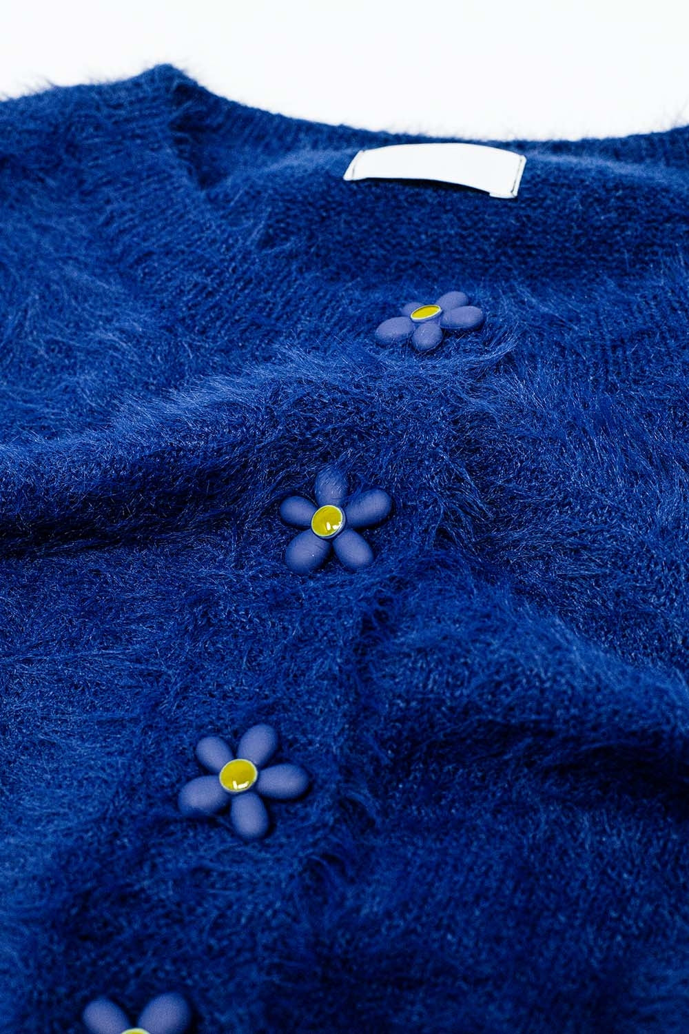 Short and fluffy navy cardigan with flower buttons - Cardigans