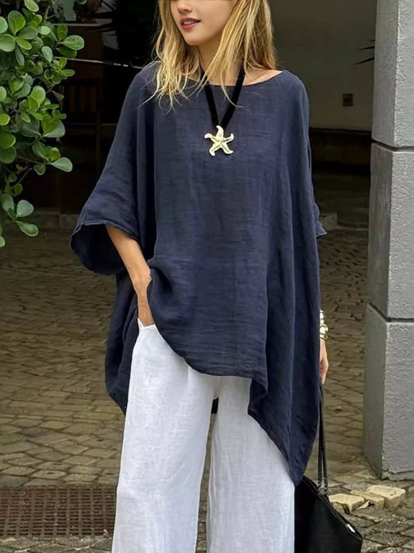 Trendsi asymmetrical hem top in navy, styled with white trousers for a chic summer look