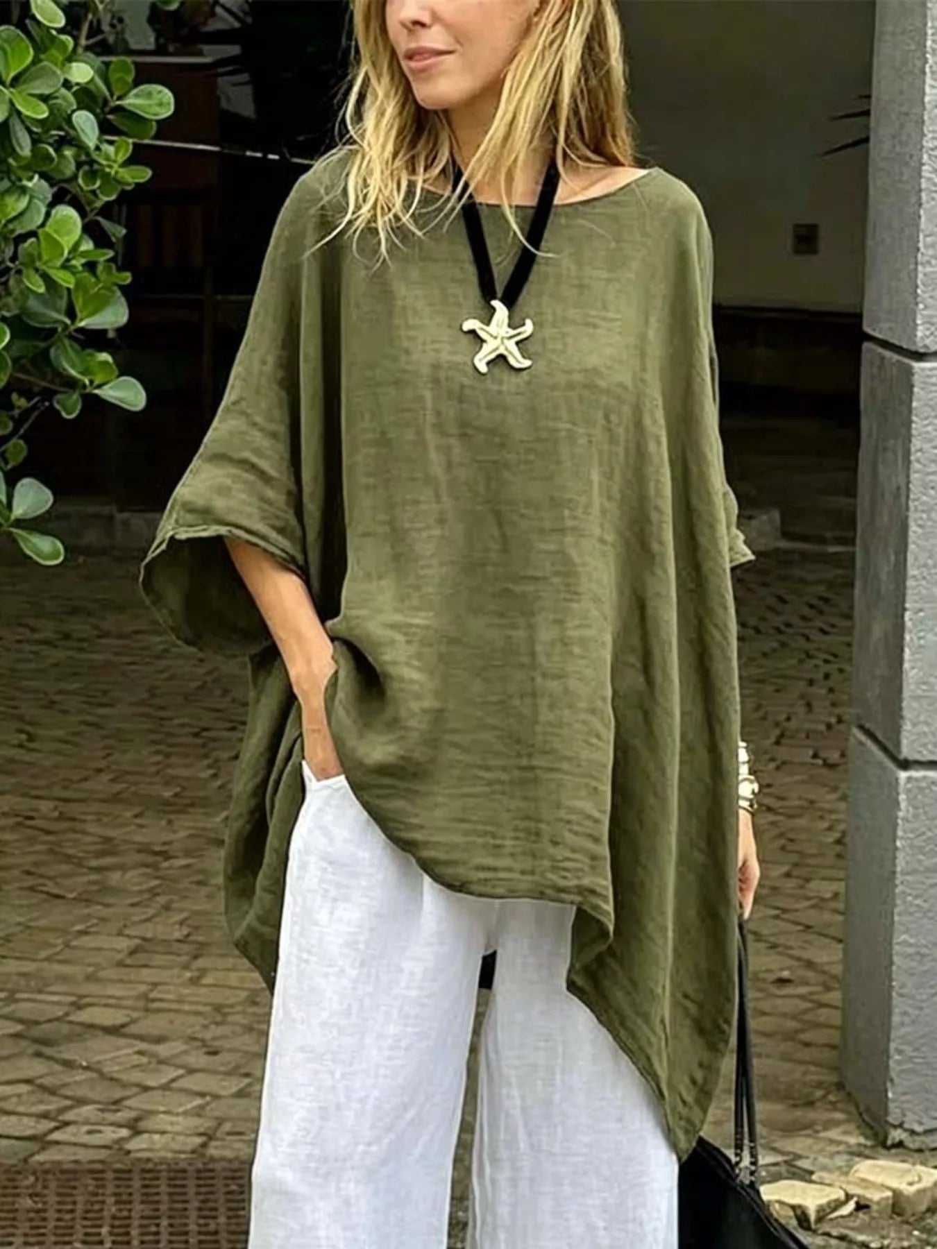 Olive green asymmetrical hem top with relaxed fit and wide sleeves for casual summer style