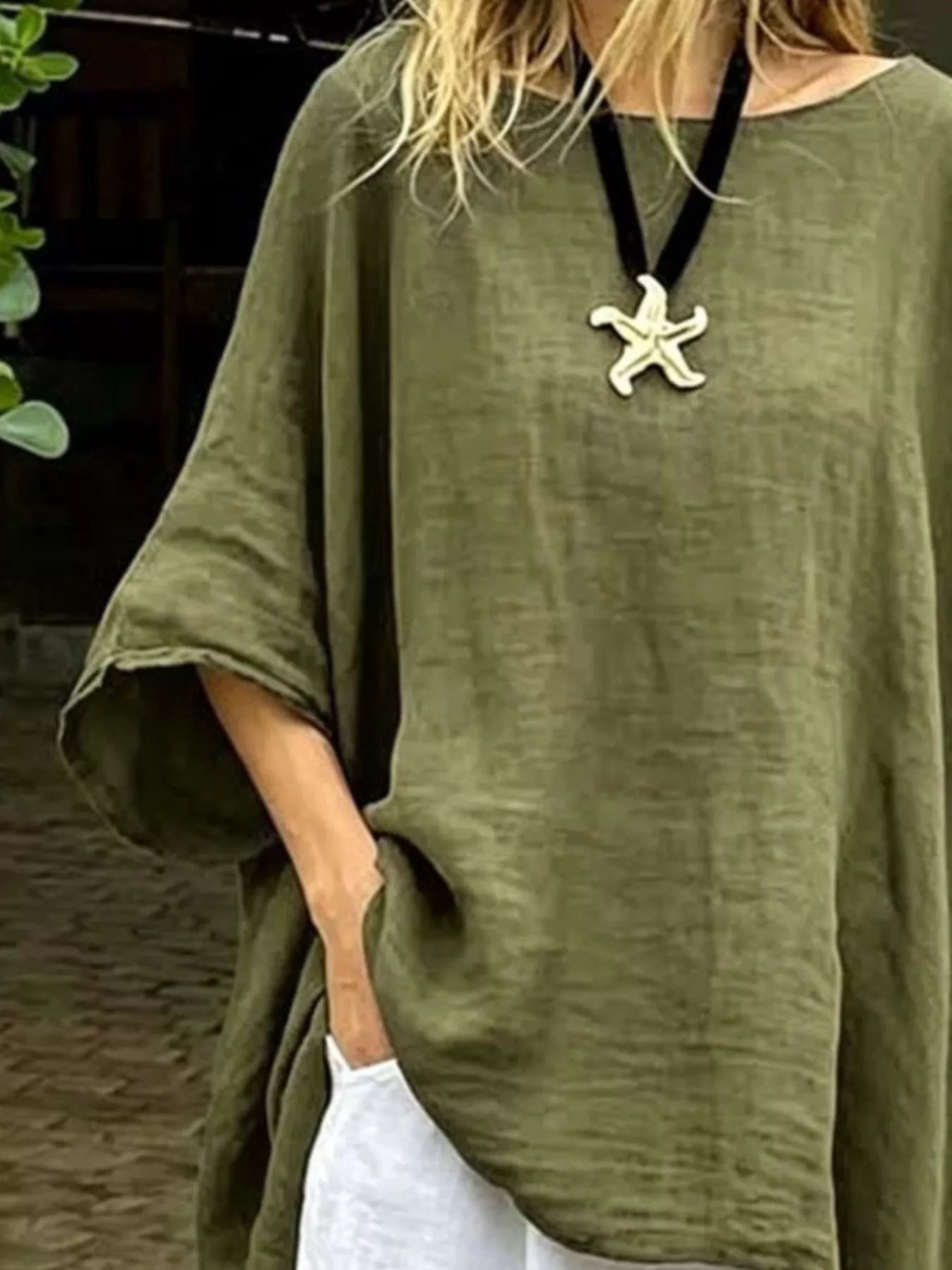 Trendsi olive green asymmetrical hem top featuring loose sleeves and relaxed fit