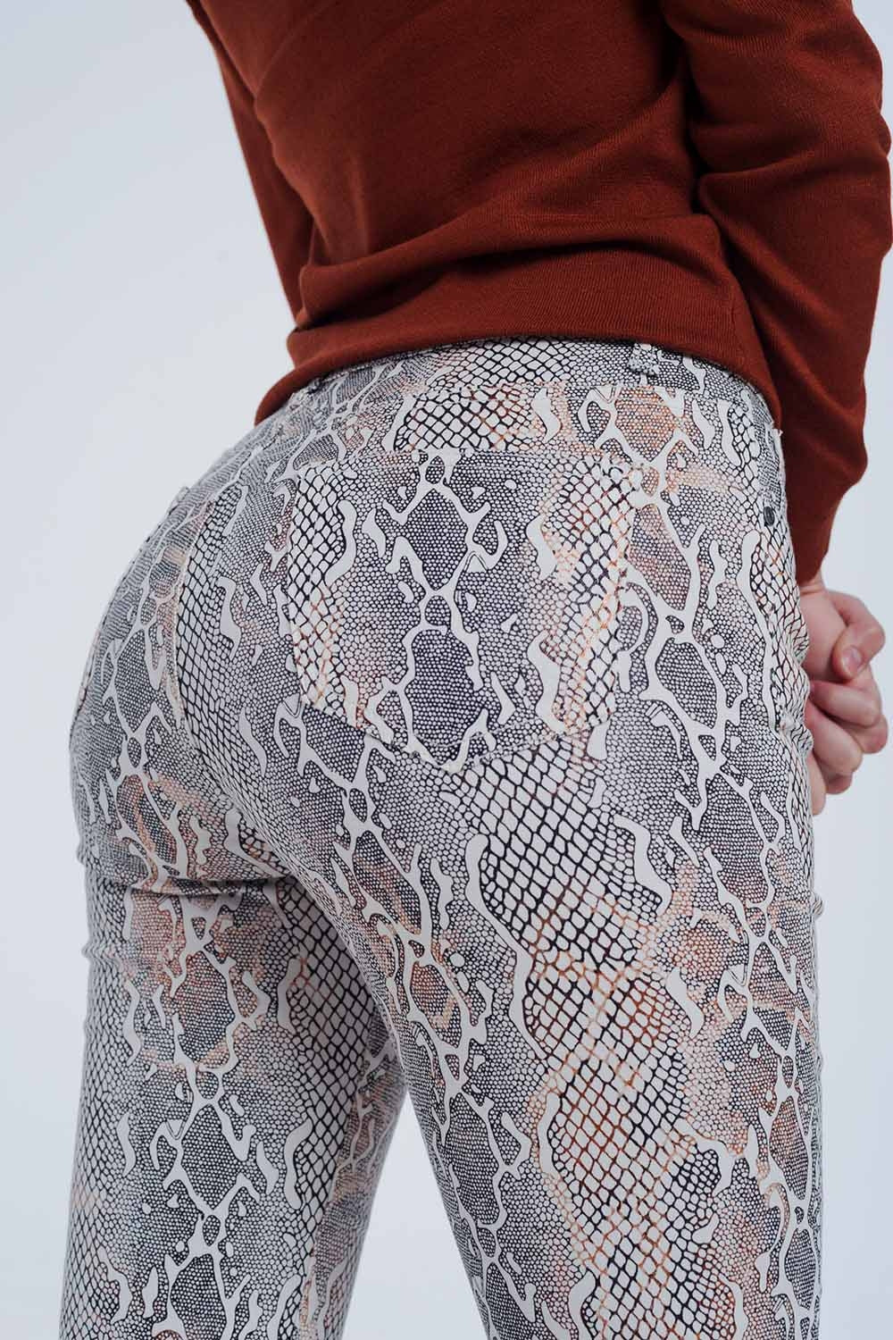 beige coloured pants with snake print - Trousers