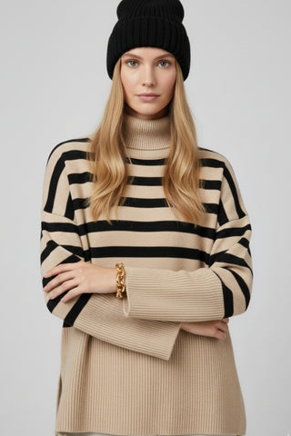 Beige oversized turtleneck sweater with black stripes and splits on the side