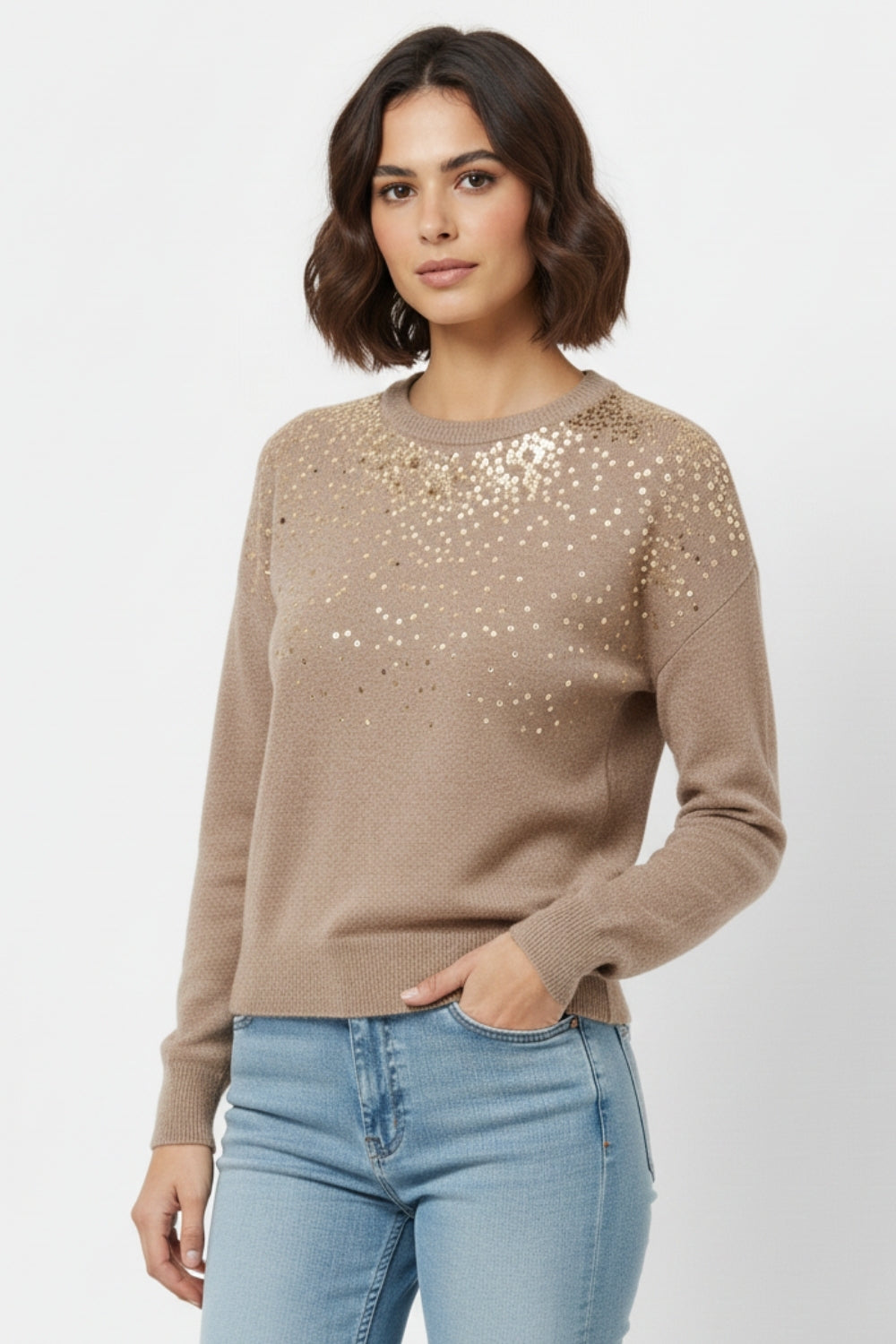 Beige soft knit sweater embellished with sequins on the front -