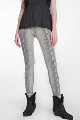 beige super skinny reversible pants with snake print