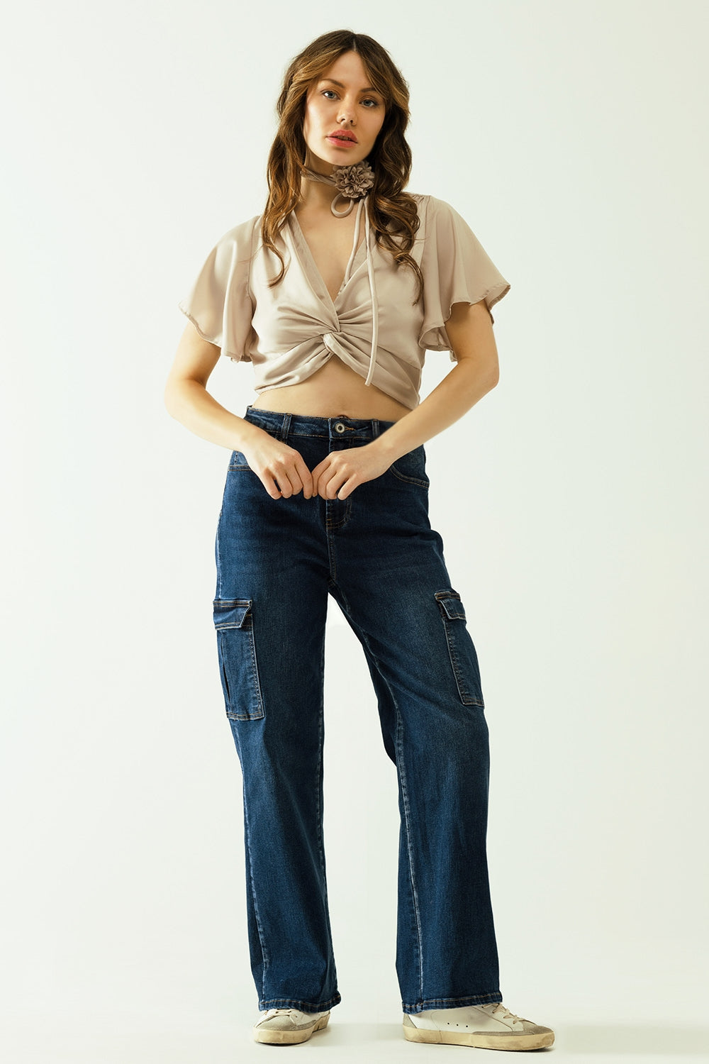 Beige V-neck crop top with short sleeves and a flower detail on the neck - Tops
