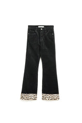 Pantalon évasé en velours côtelé noir avec imprimé léopard en bas