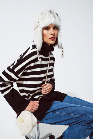 Black oversized trutleneck sweater with white stripes and splits on the side