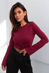 Blouse long flared sleeves and a round neckline