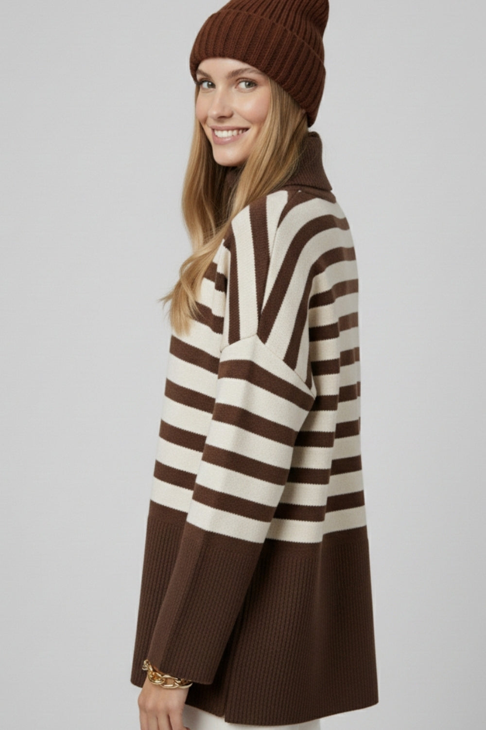 Brown oversized turtleneck sweater with white stripes and splits on the side -