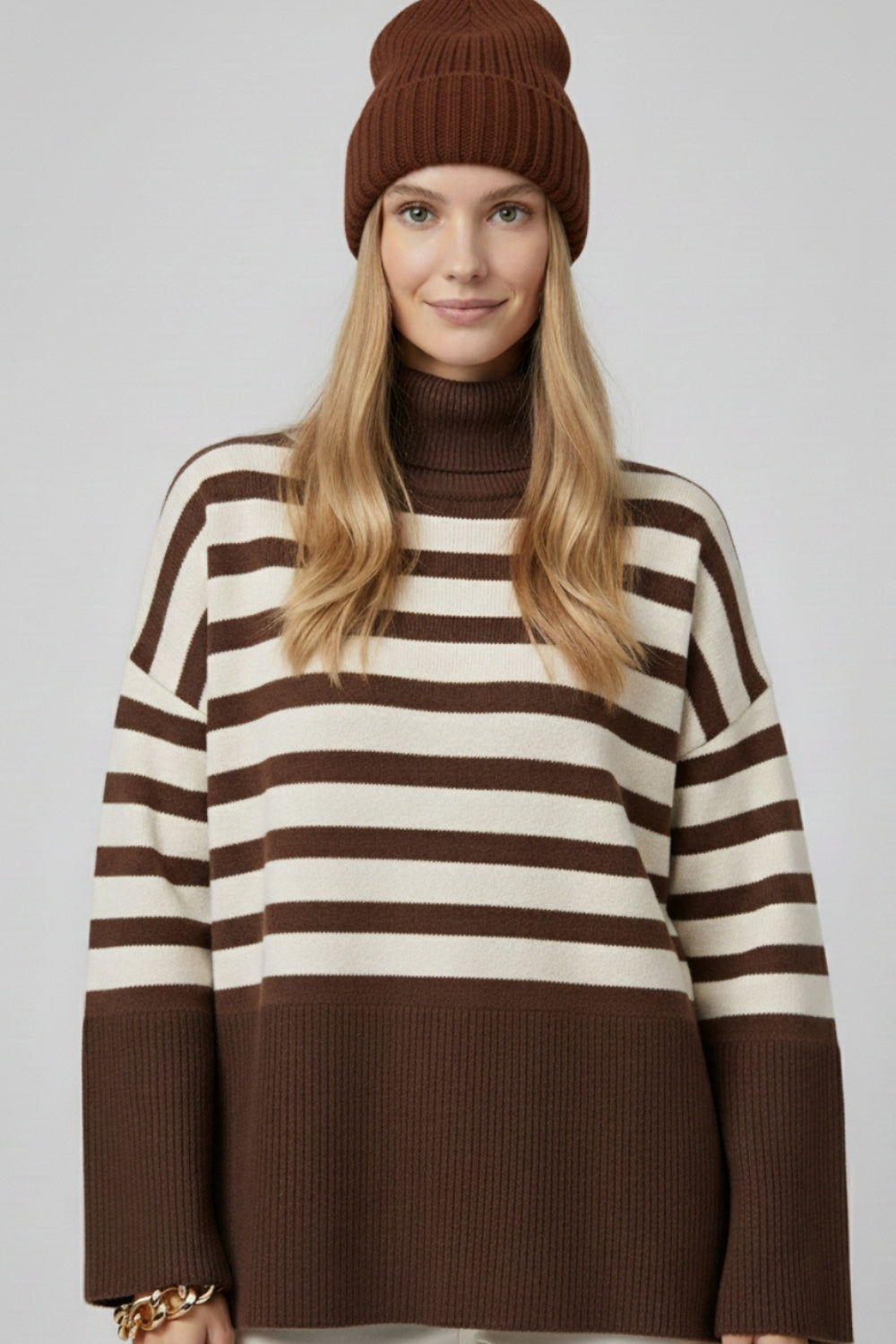 Brown oversized turtleneck sweater with white stripes and splits on the side -