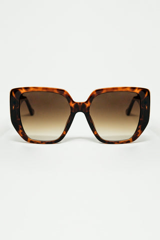 Brown pin-up style sunglasses with geometric design and cat eyes