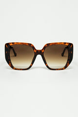 Brown pin-up style sunglasses with geometric design and cat eyes