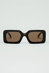 brown square sunglasses with green animal print on the side