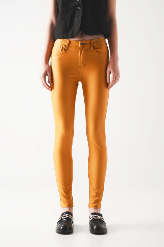 Coated pants in orange - Trousers