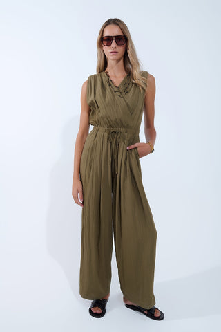 draped olive jumpsuit in crinkled fabric