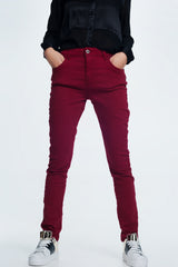 Drop crotch skinny jean in maroon