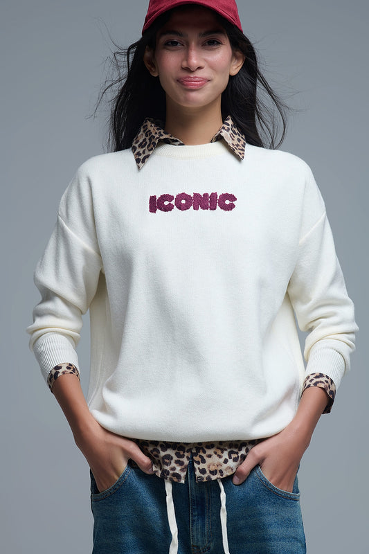 Embroidered ICONIC Sweater with Global Tour Back Print in Cream - Sweaters